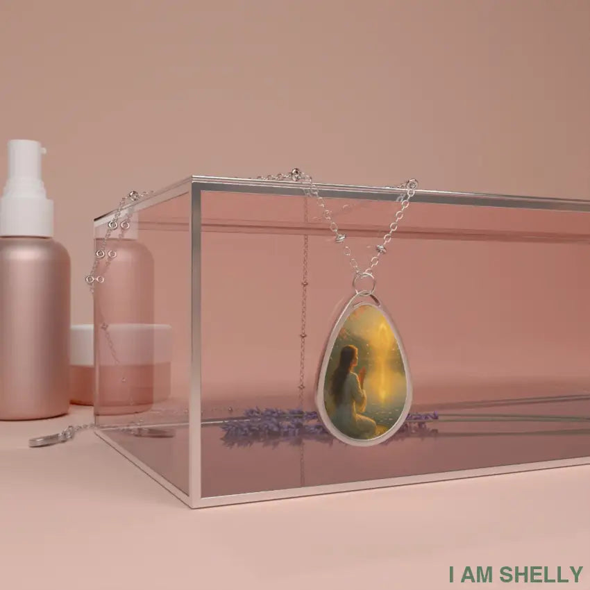 Muse Evolves — Teardrop Pendant Description: A luminous teardrop pendant capturing the moment of transformation. One