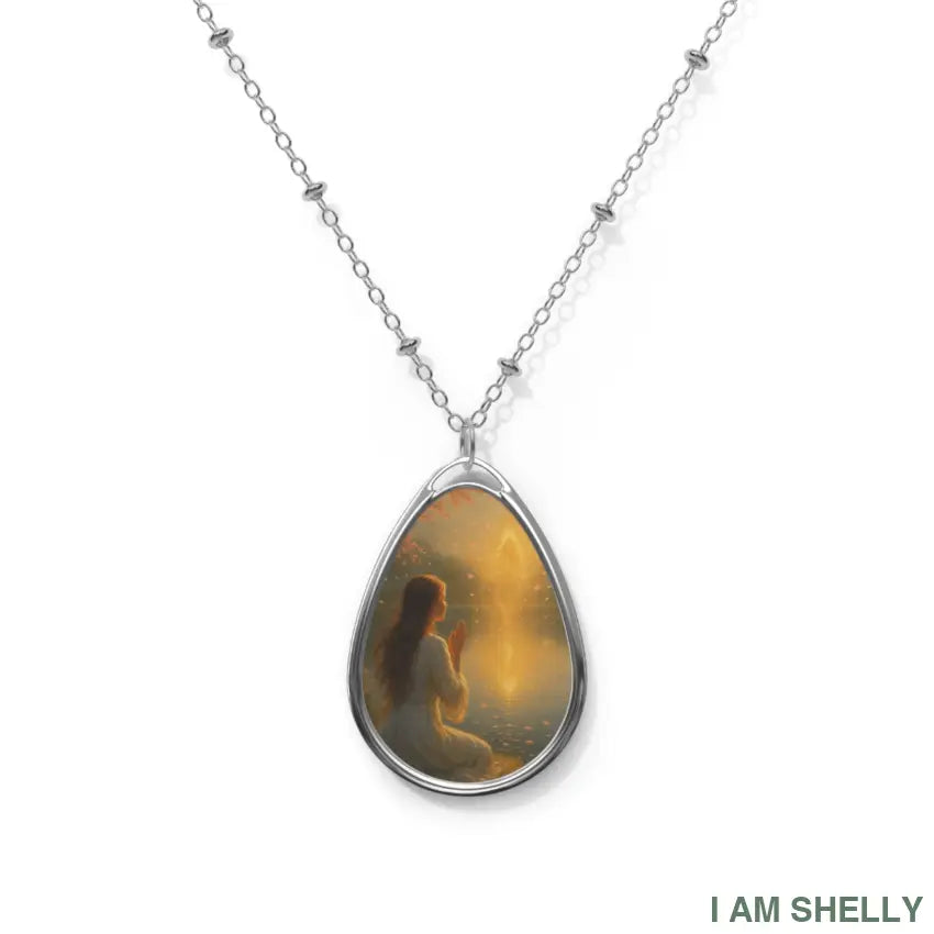 Muse Evolves — Teardrop Pendant Description: A luminous teardrop pendant capturing the moment of transformation. One